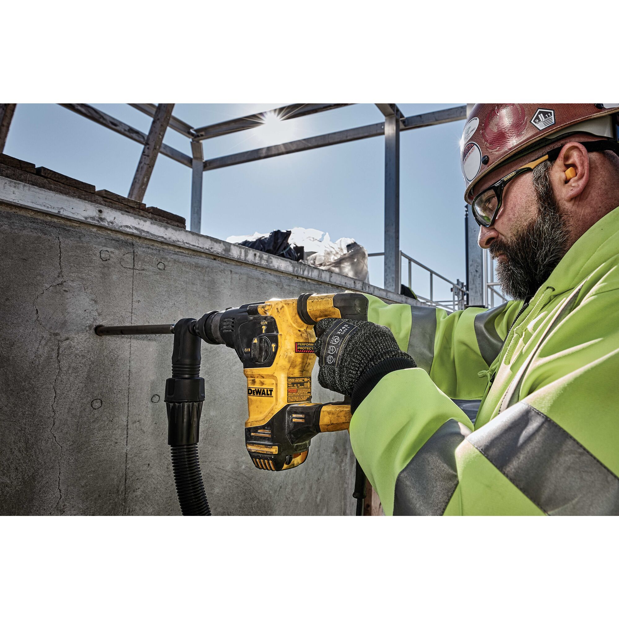 SDS Plus rotary hammer being used by person to drill hole in  wall