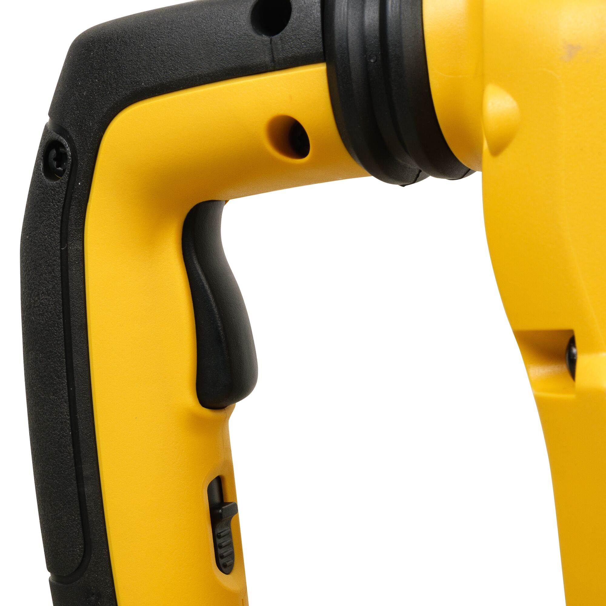 Close-up view of the handle and trigger area of a yellow and black power tool, showing the textured grip and control switch.