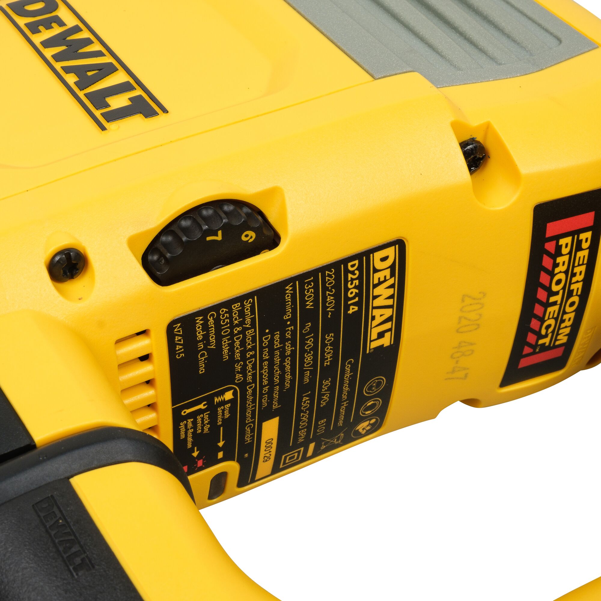 Close-up image of a yellow DEWALT power tool showing the model number D25614K and product label, with a performance protection sticker and adjustment dial.