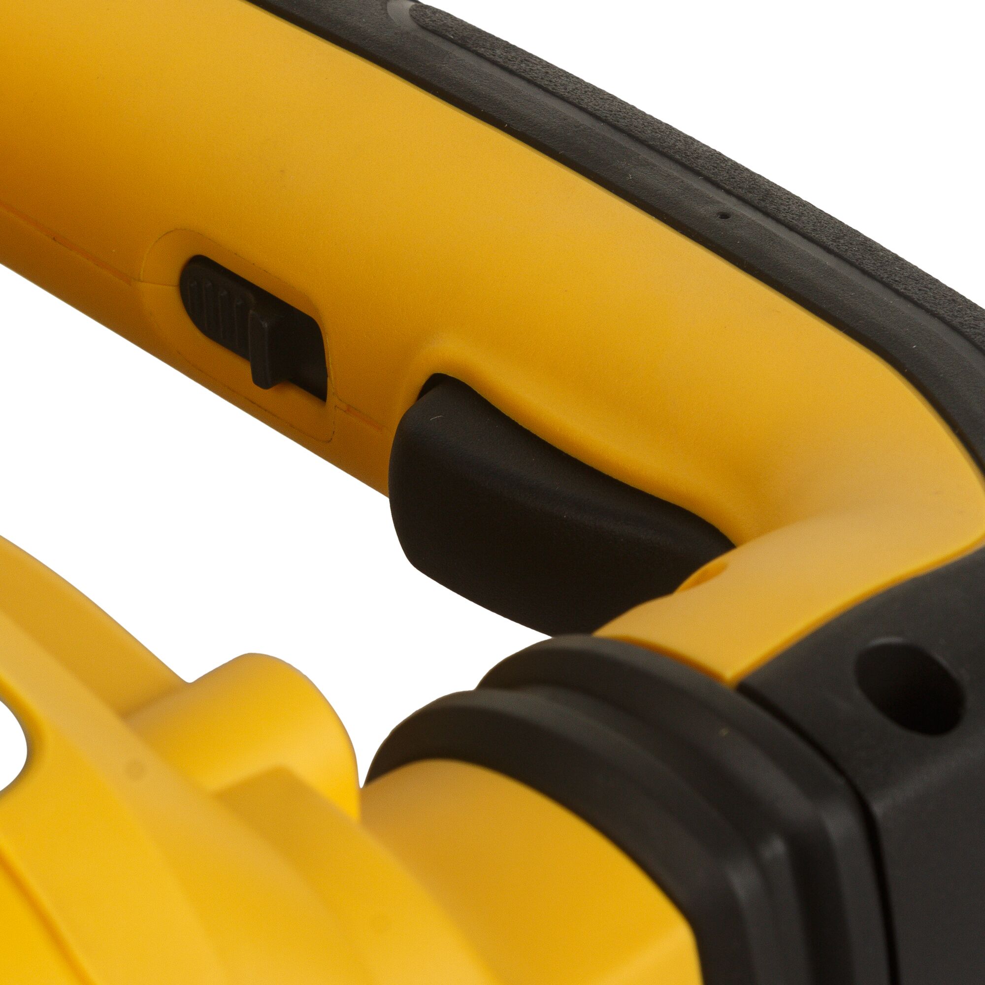 Close-up view of a yellow and black DEWALT power tool handle, featuring a black trigger and a slider switch.