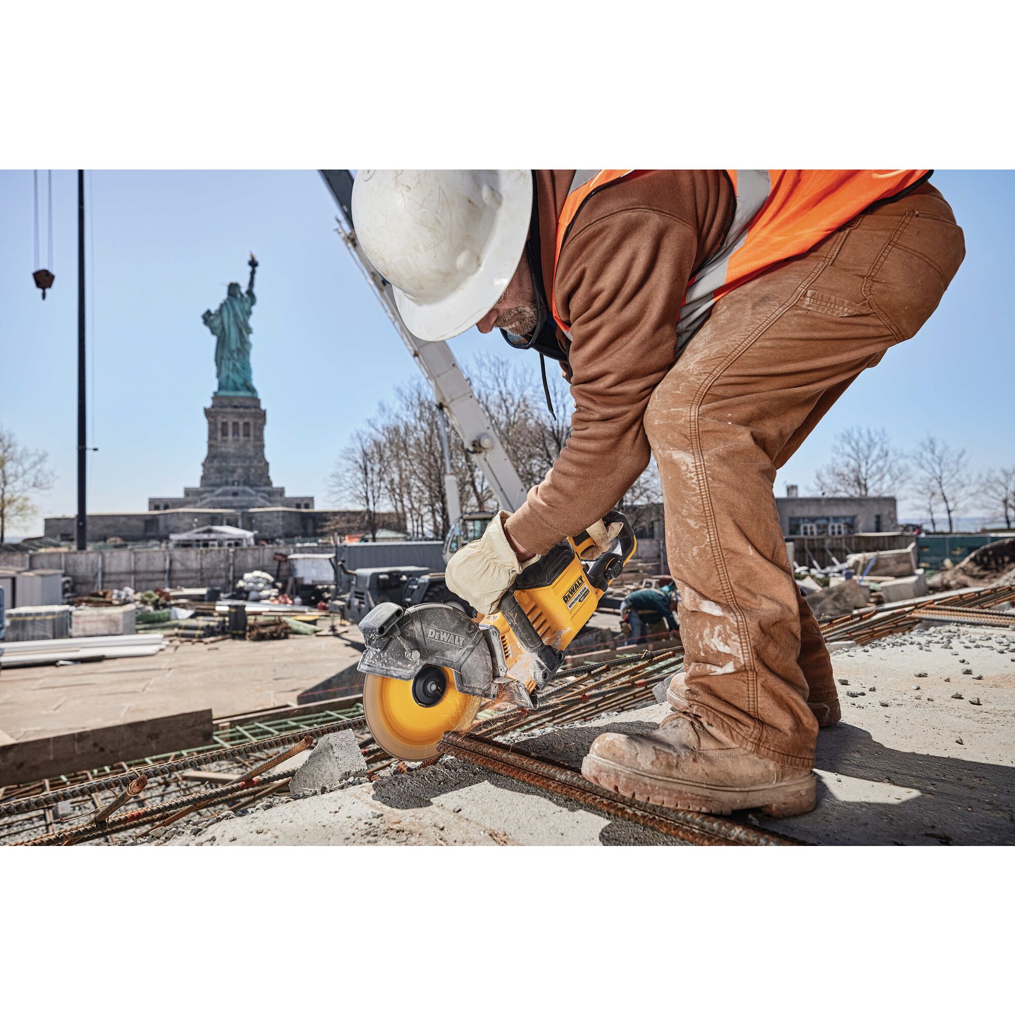 20 Volt to 60 Volt 12 AMP hours Battery powering a Circular Saw being used by a construction worker to cut metal pipes at a construction site