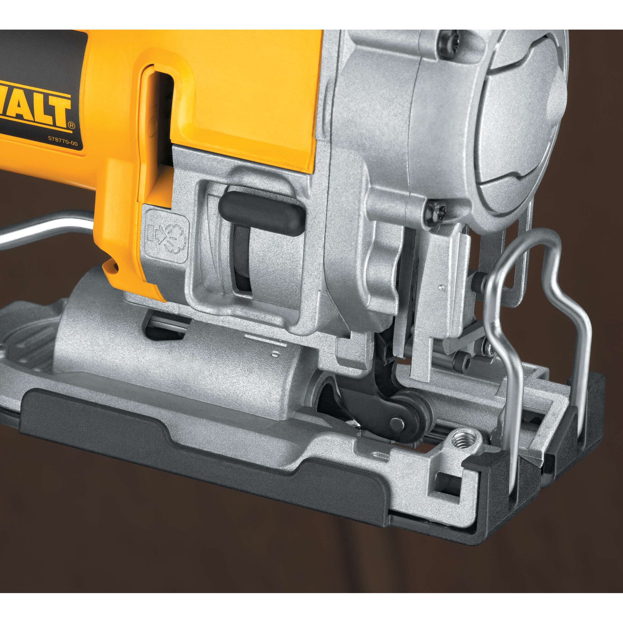 Close-up view of a DEWALT jigsaw power tool, showing its metallic base, blade mount, and part of its yellow and silver body.