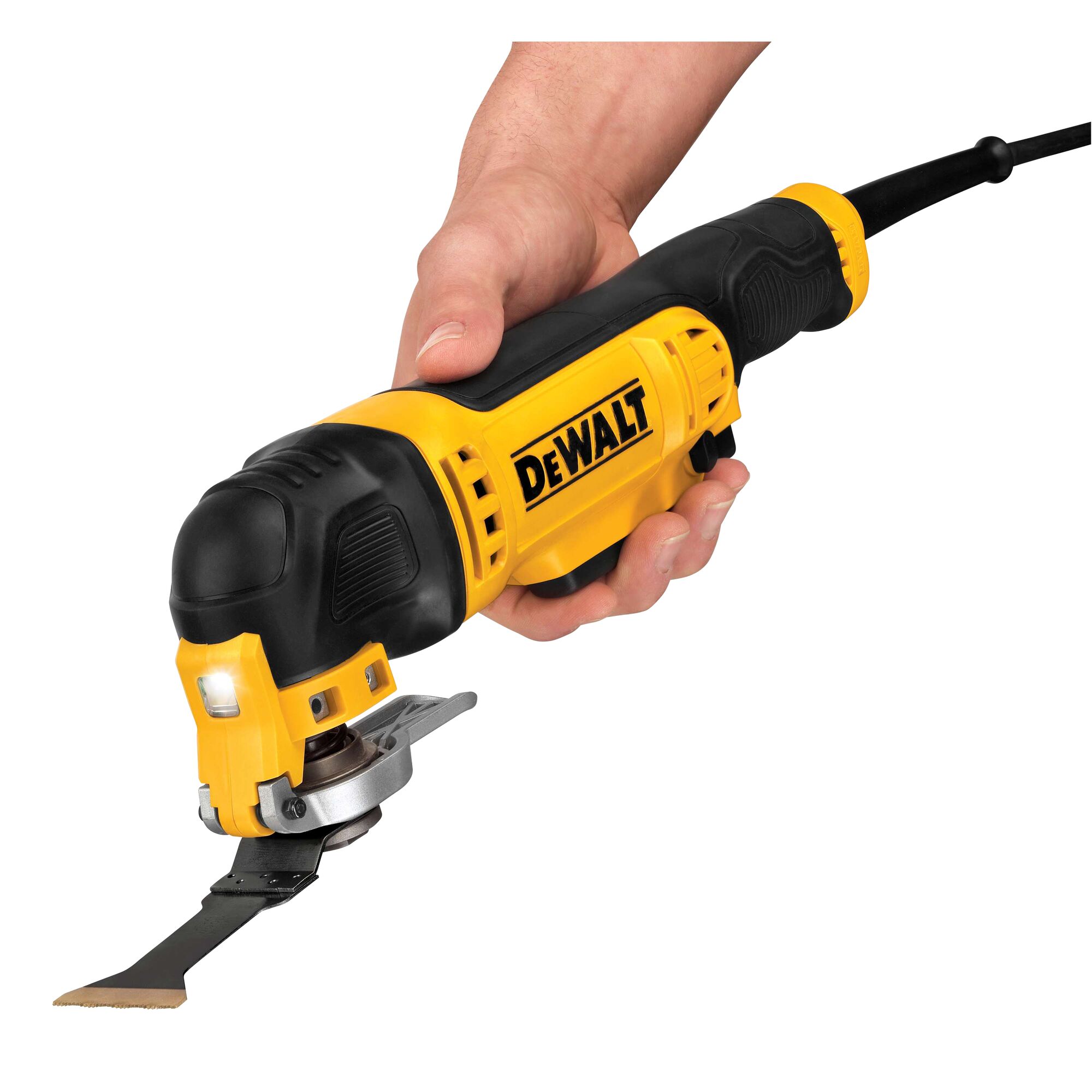 A hand holding a DEWALT DWE315K oscillating multi-tool with a yellow and black design. The tool is powered by a cord and has a flat cutting blade attached.
