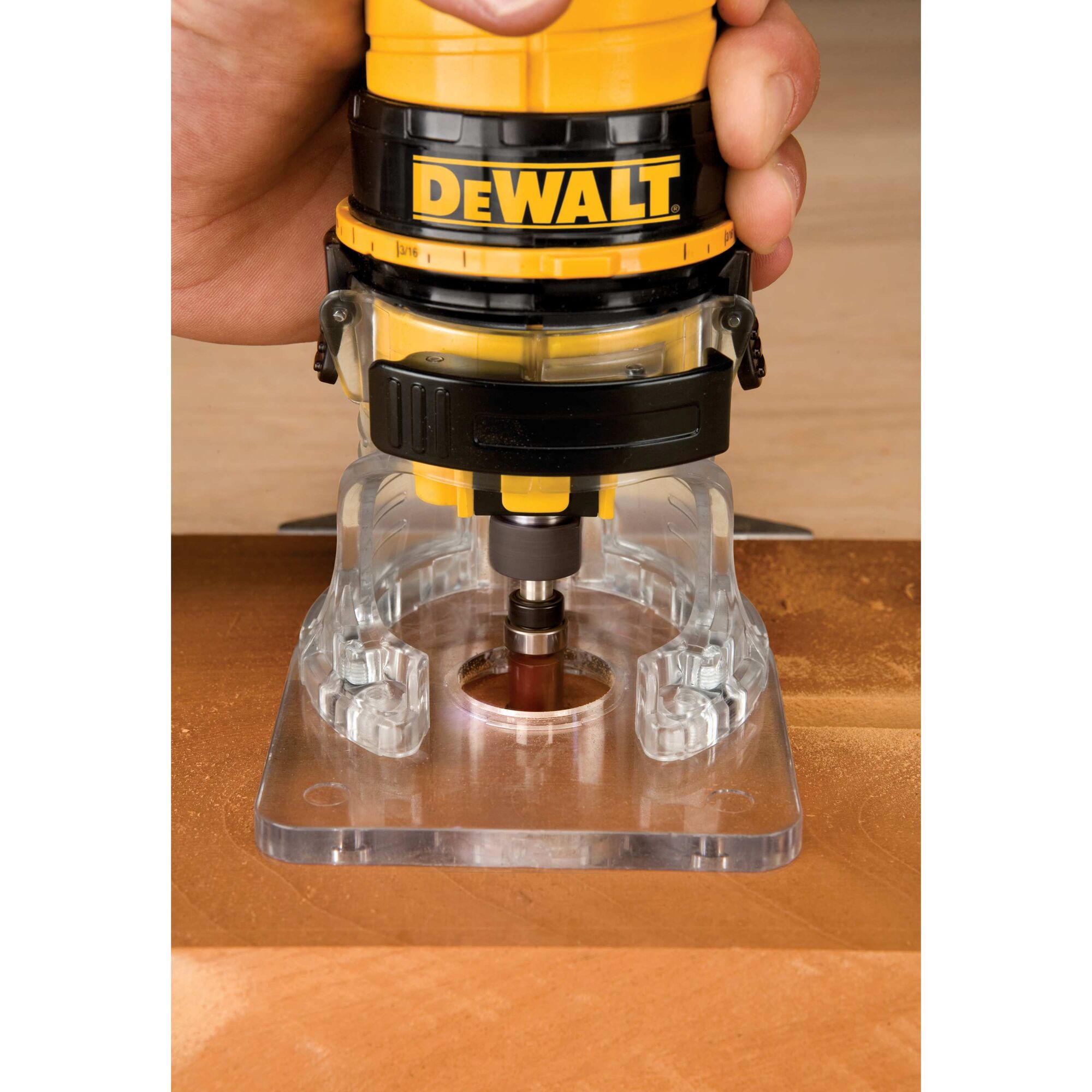 Laminate trimmer in action on a wood.