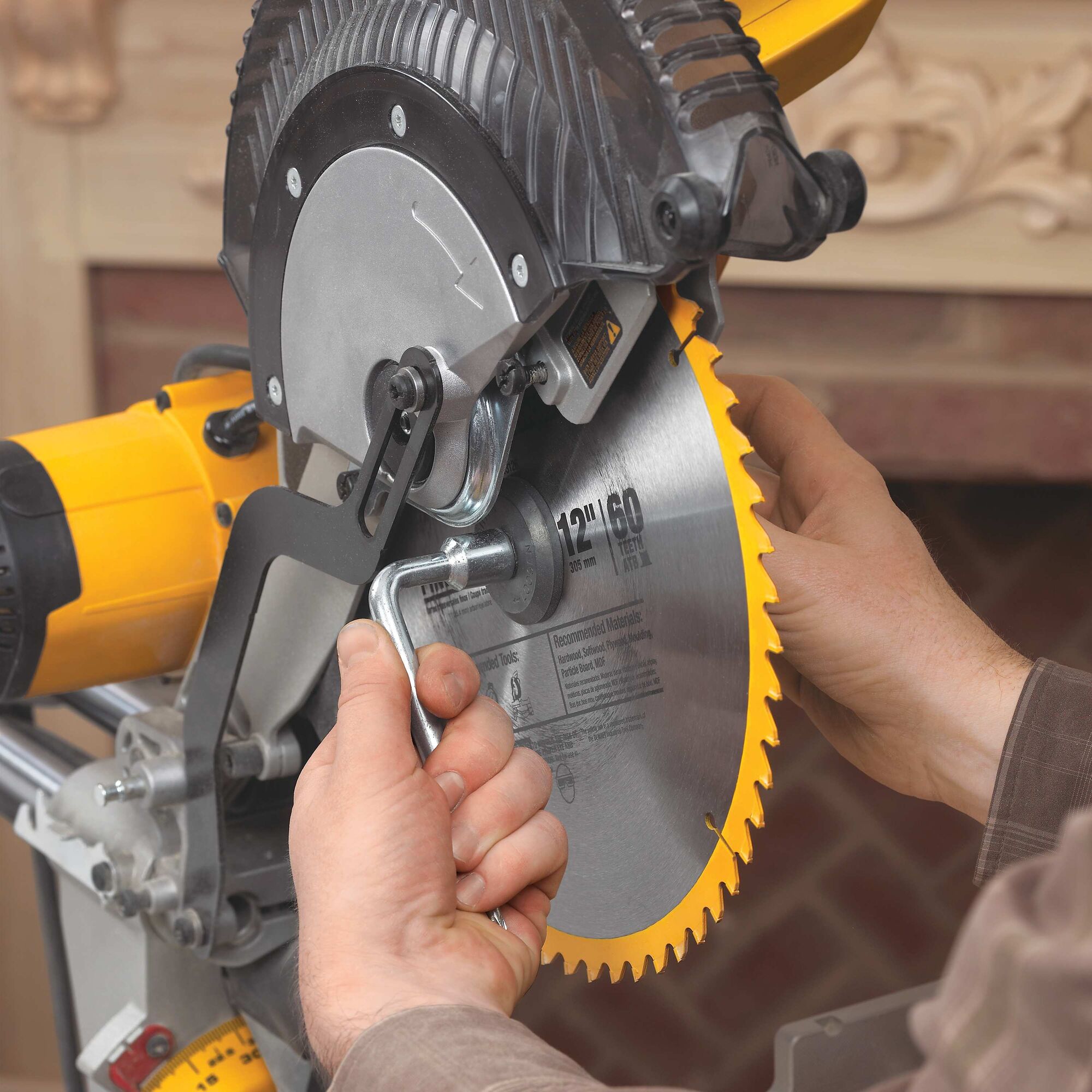 Double bevel sliding compound miter saw blade being adjusted.