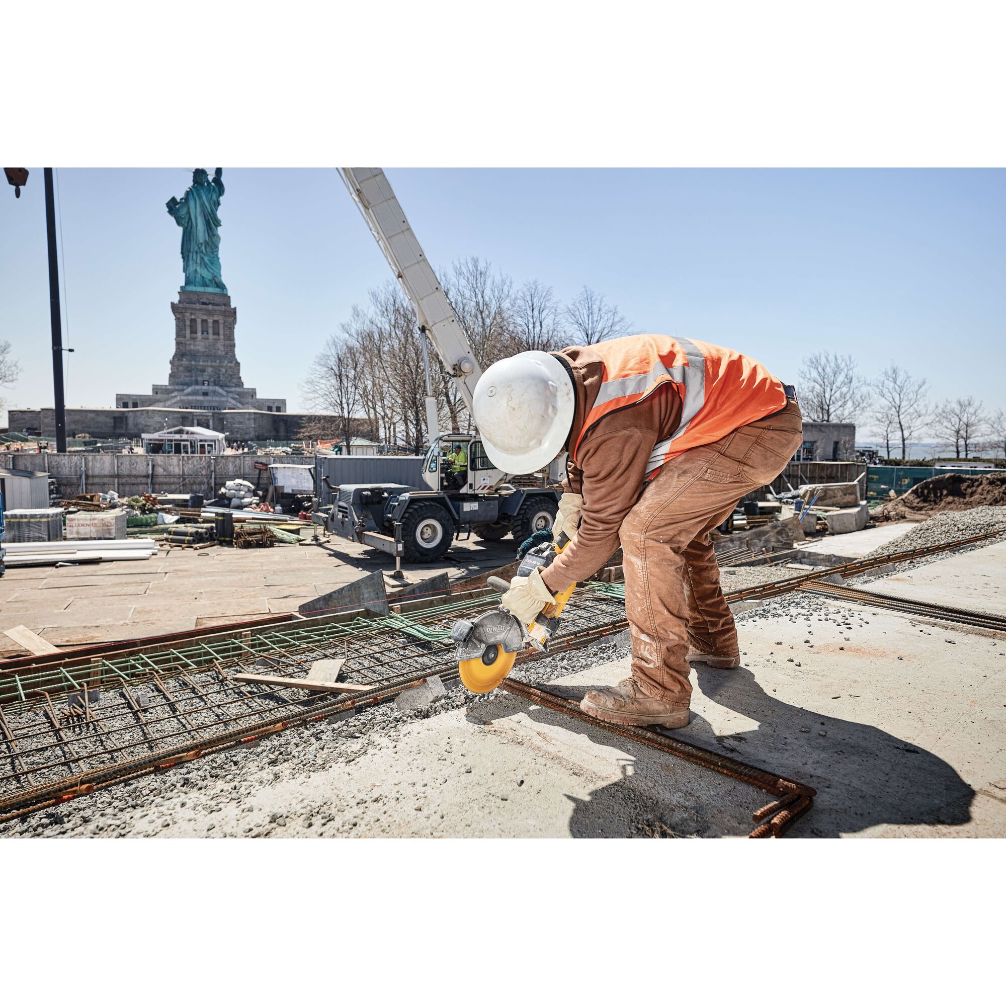 20 Volt to 60 Volt 12 AMP hours Battery powering a Circular Saw being used by a construction worker to cut metal pipes at a construction site